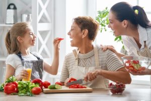 Image of family eating healthy food such as vegetables and fruits lots of fiber