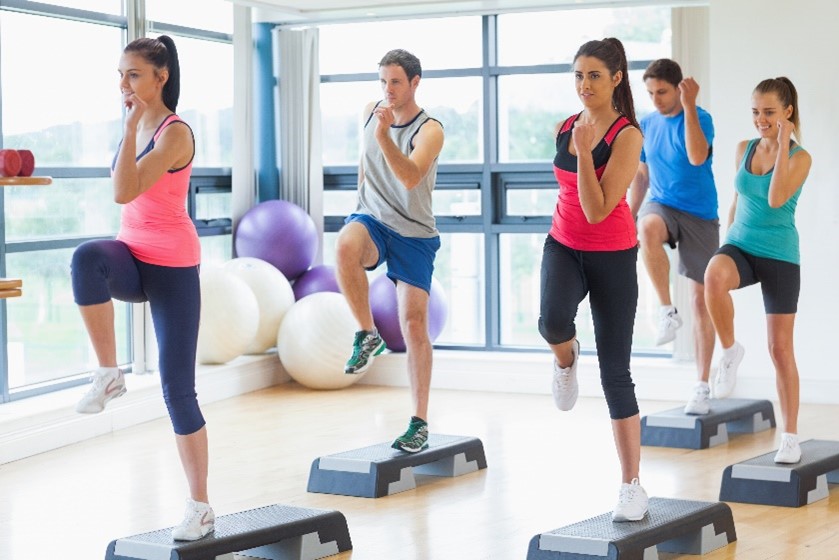 Group of people exercising in gym